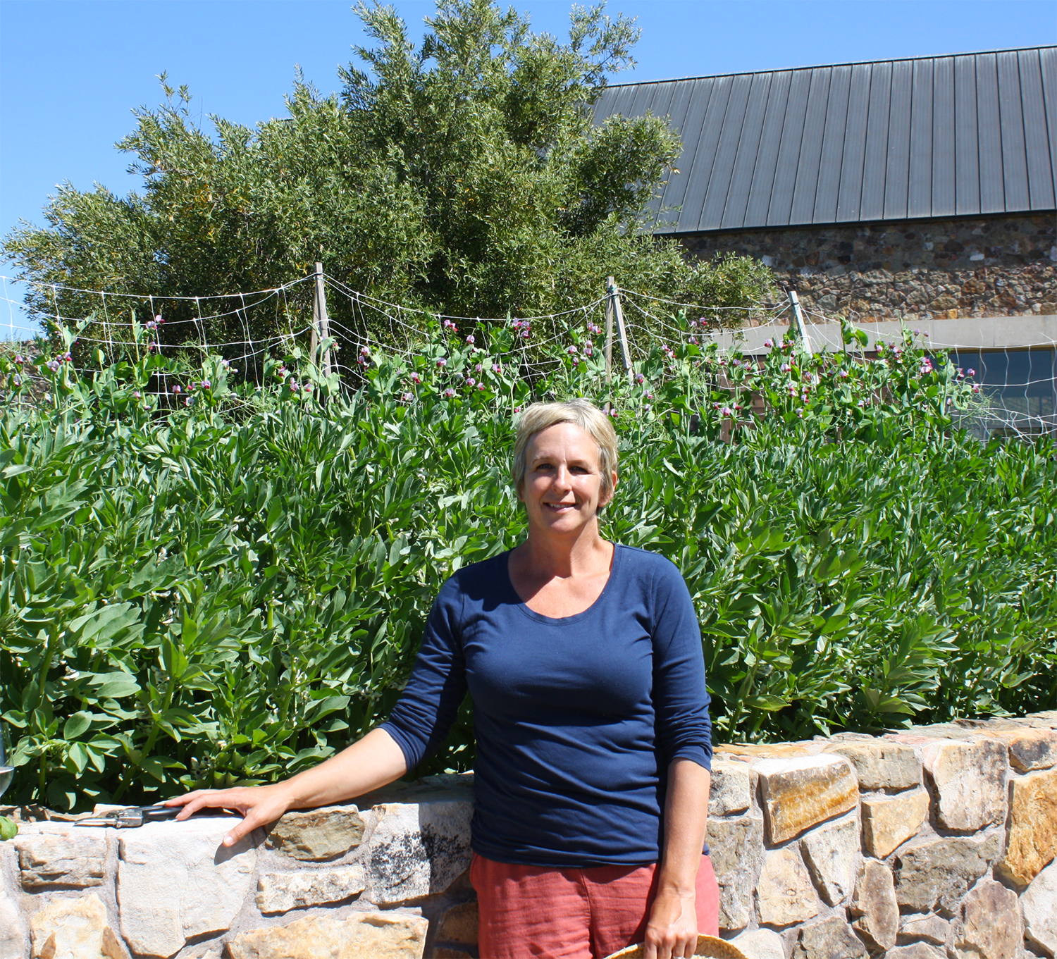 Our Estate Gardener, Annette Pollock smiling in the garden