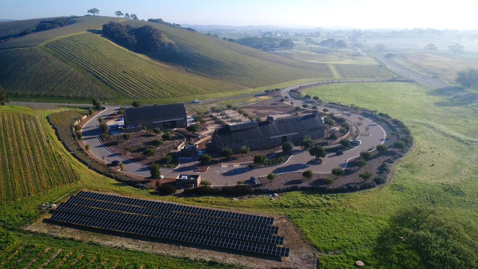 Aerial view of our tasting room, craft winery, solar panels and vineyards