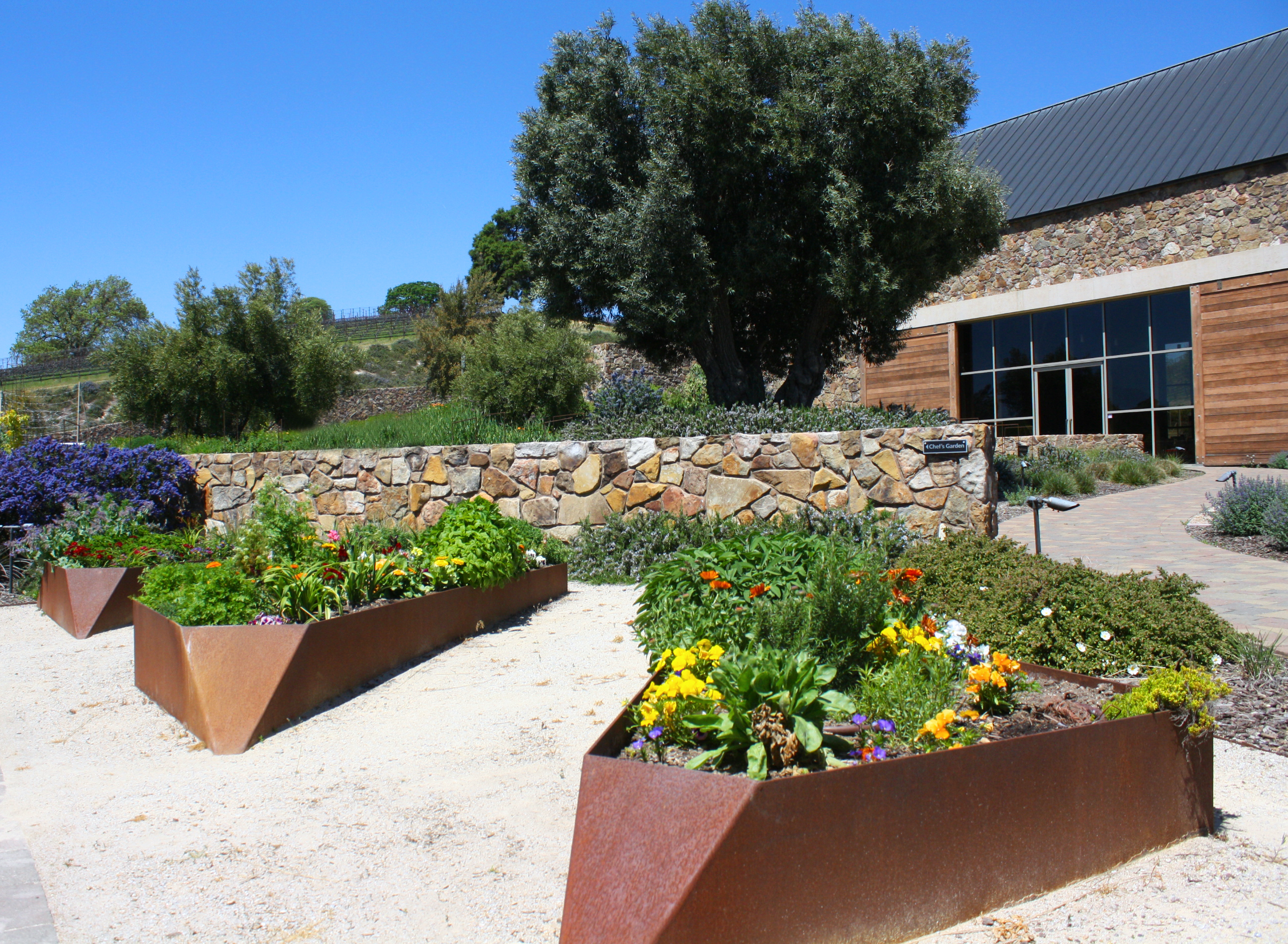 Raised herb and flower beds in our Chef's garden
